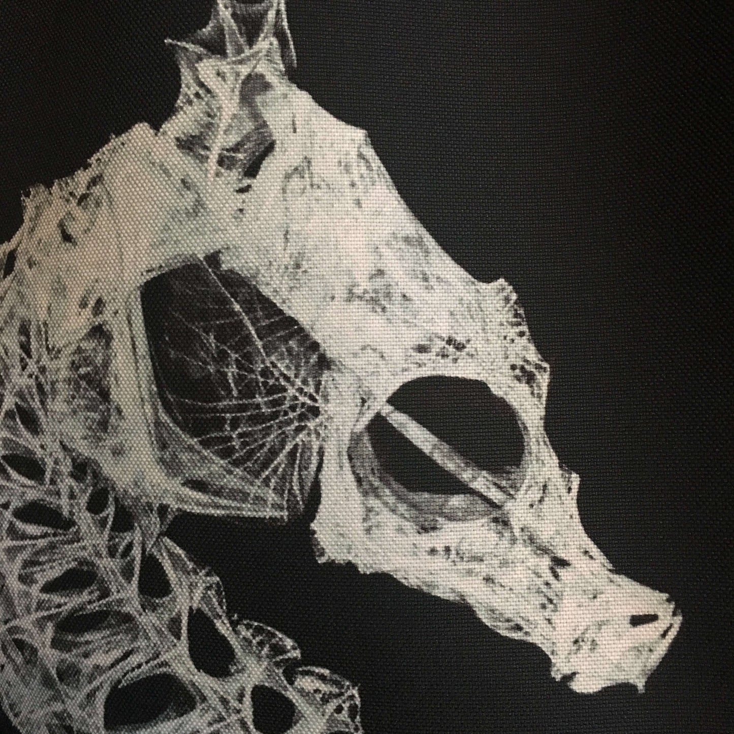 Close up of seahorse skeleton logo on reusable cloth tote bag