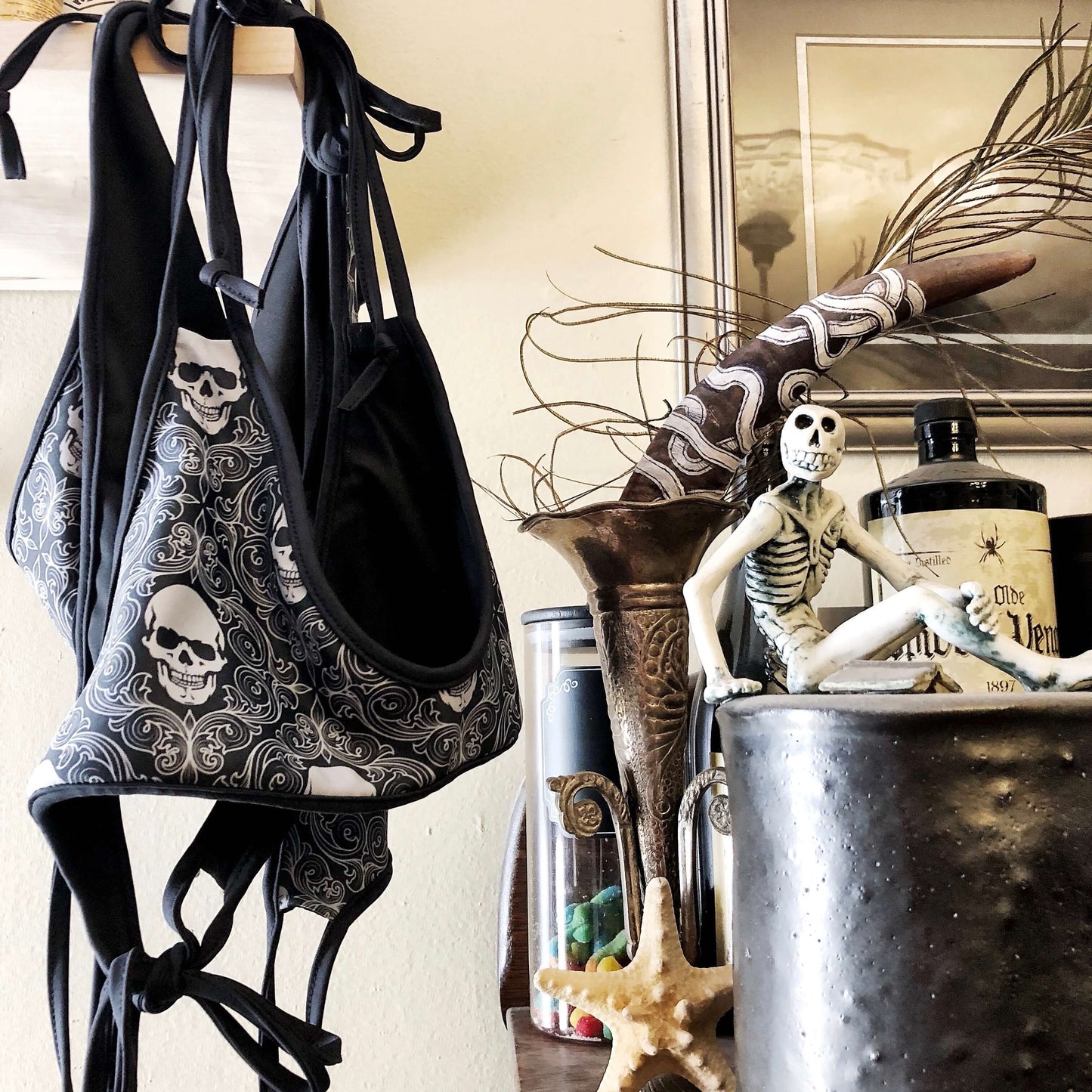 skeleton wallpaper bikini hanging near various skeleton-themed items