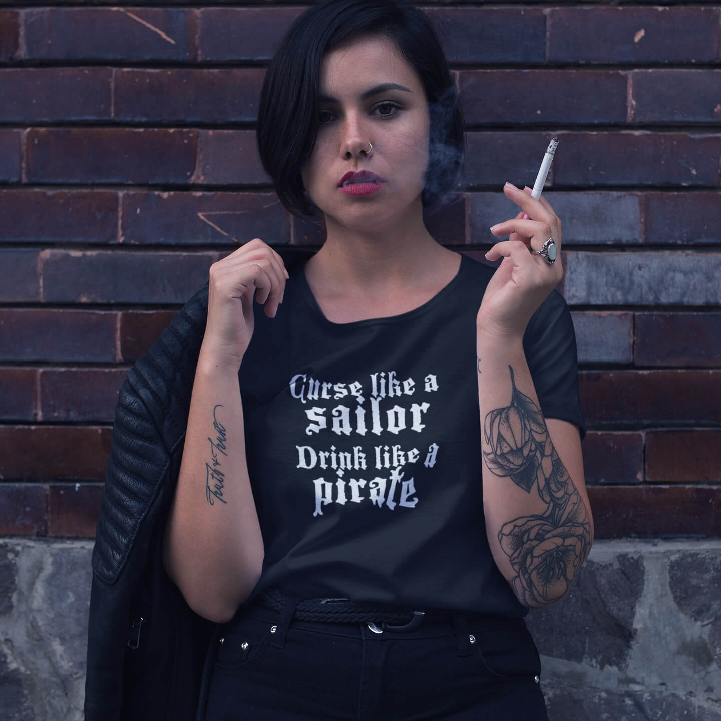 Dark haired woman smoking wearing curse like a sailor drink like a pirate tee scoop neck