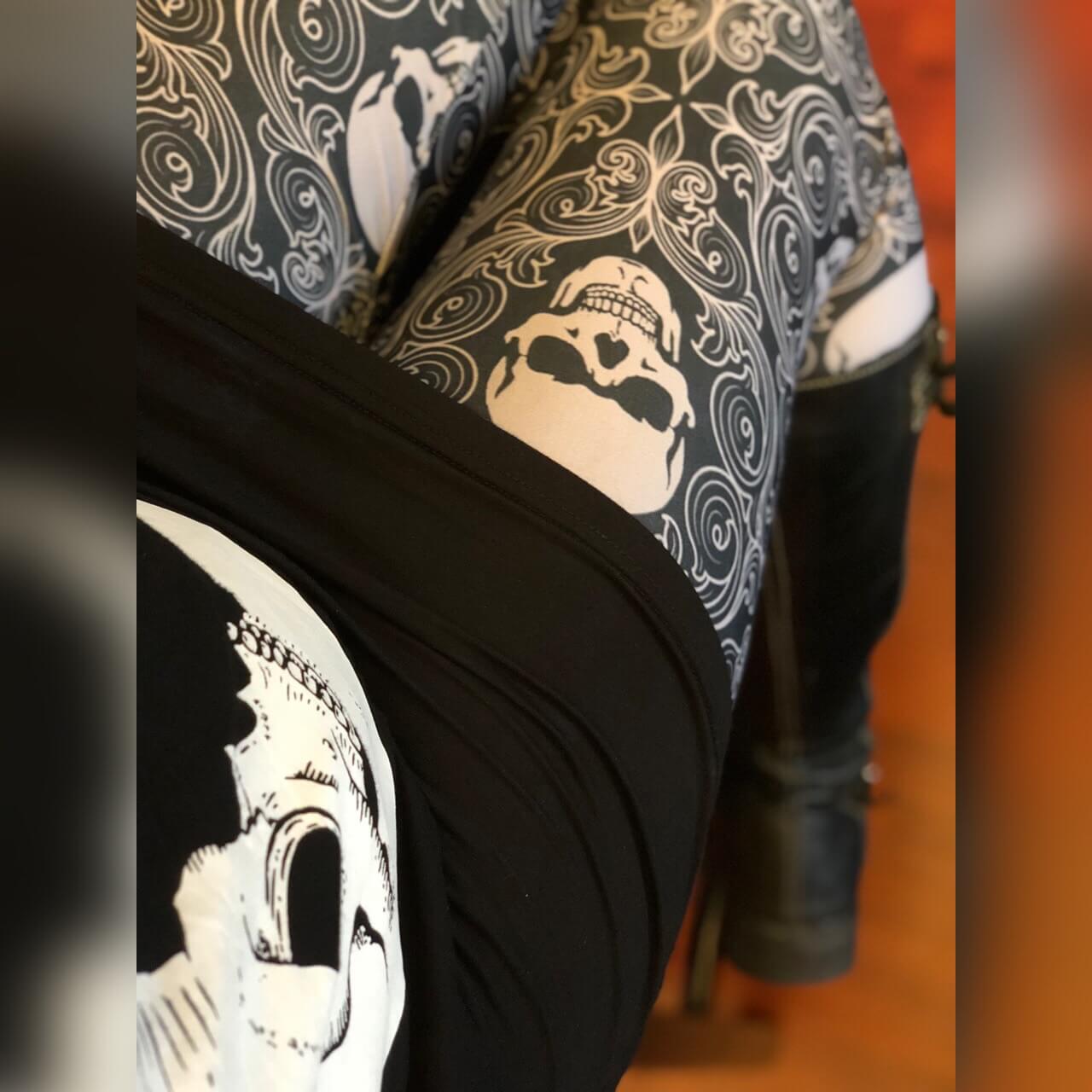 Skull print leggings close up with skull moon dress and boots