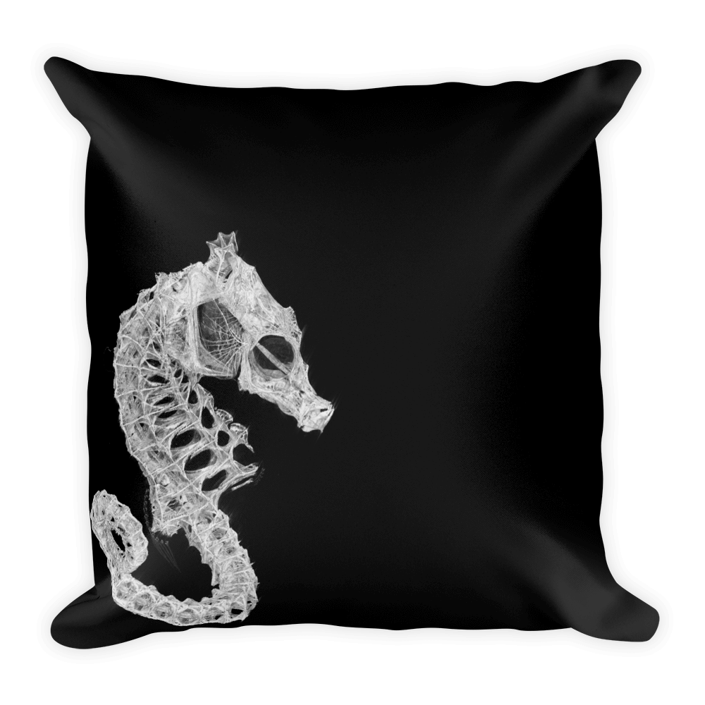 Square black throw pillow with seahorse skeleton print