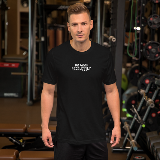 Man in shirt that reads "do good recklessly" at the gym