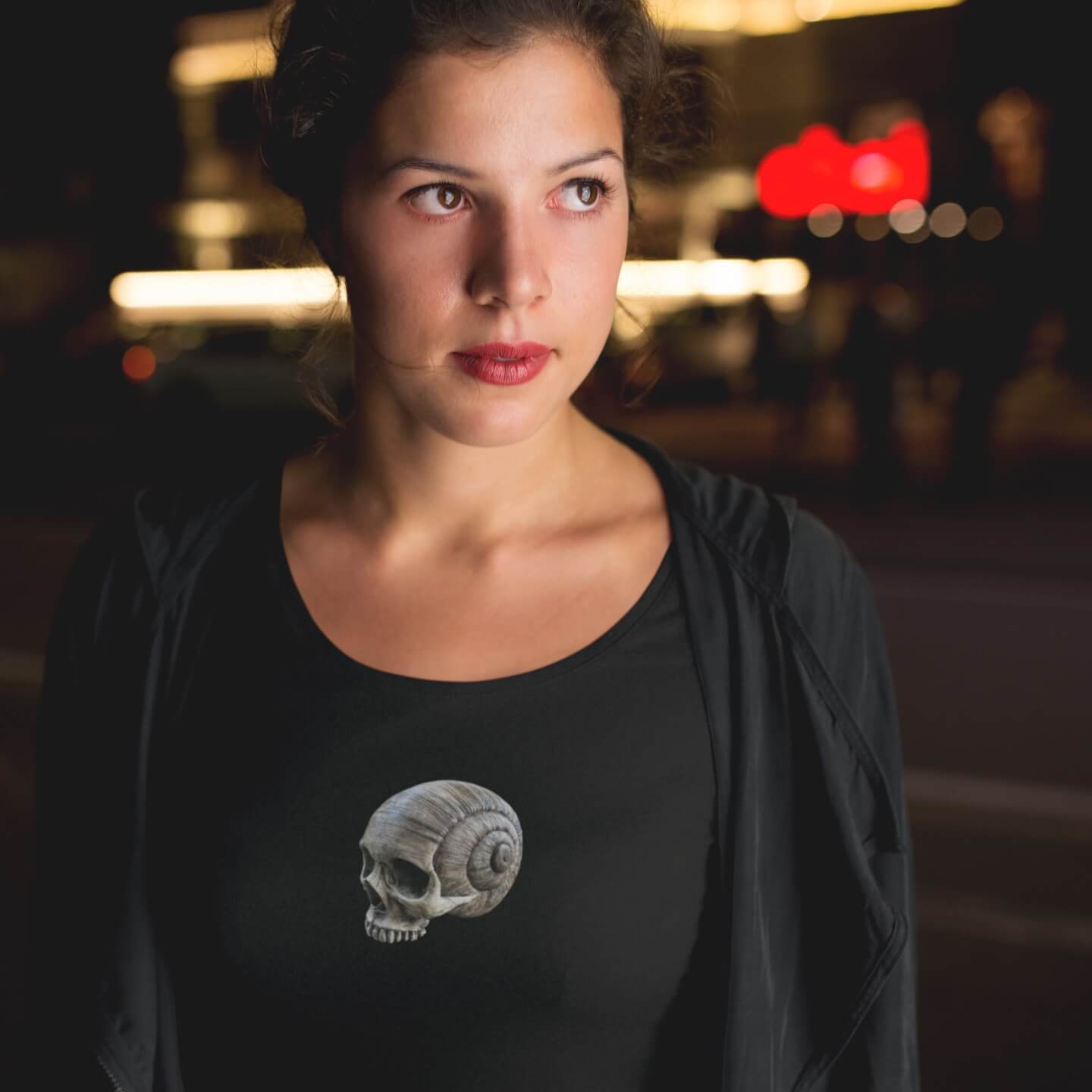 Woman wearing scoop neck spiral skull printed t-shirt